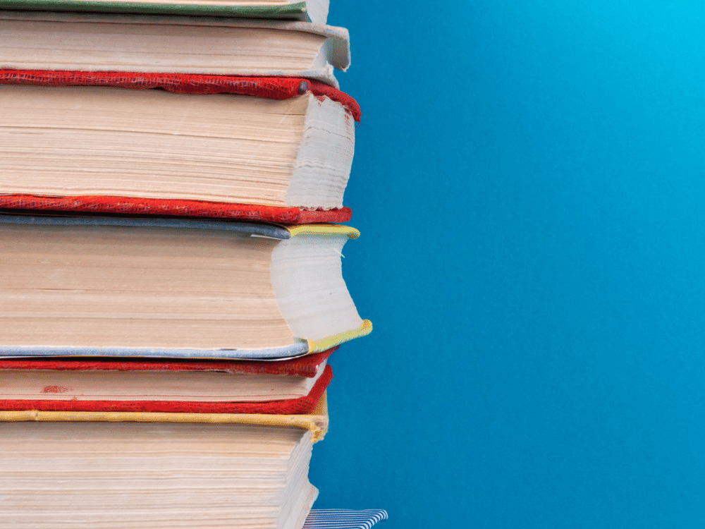 stack of books with blue background